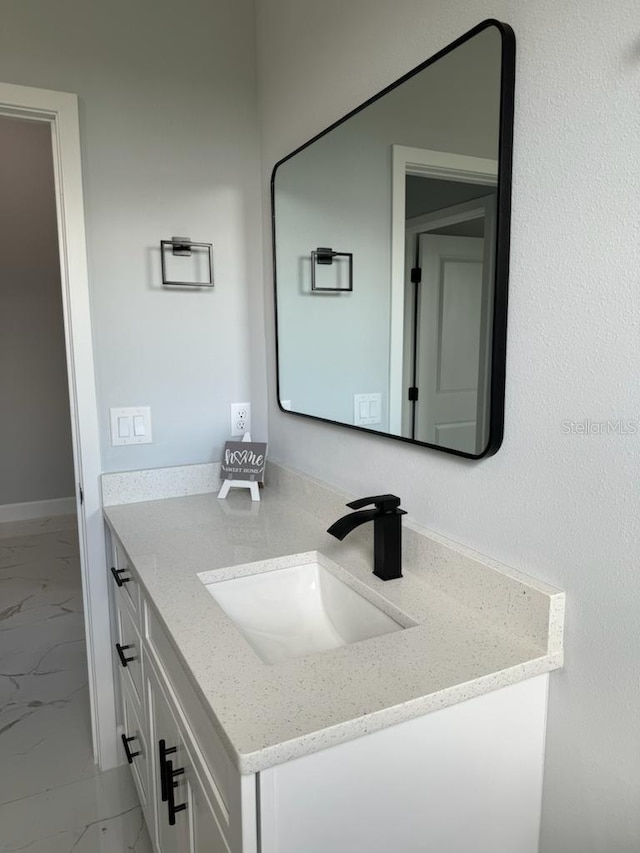 bathroom featuring tile flooring and vanity