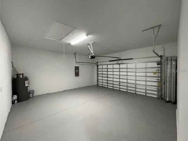 garage featuring a garage door opener and electric water heater