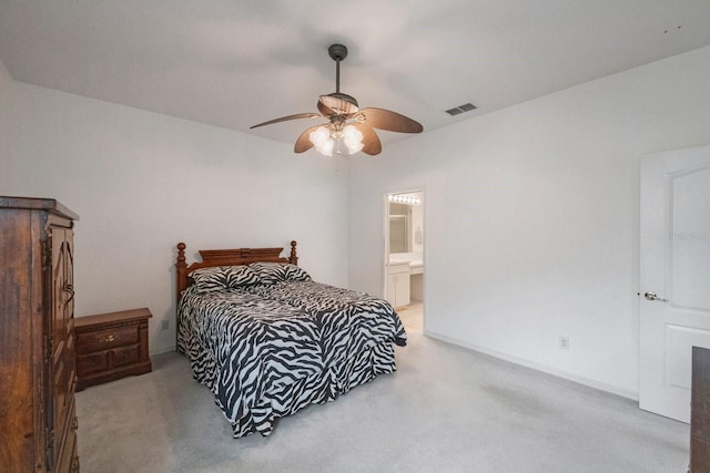 bedroom featuring ceiling fan, connected bathroom, and carpet flooring