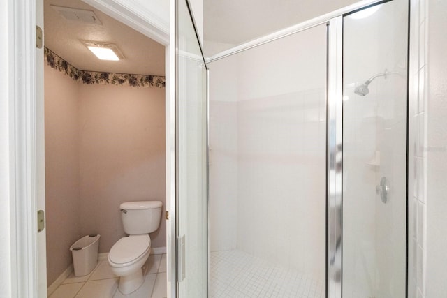 bathroom featuring tile flooring, walk in shower, and toilet