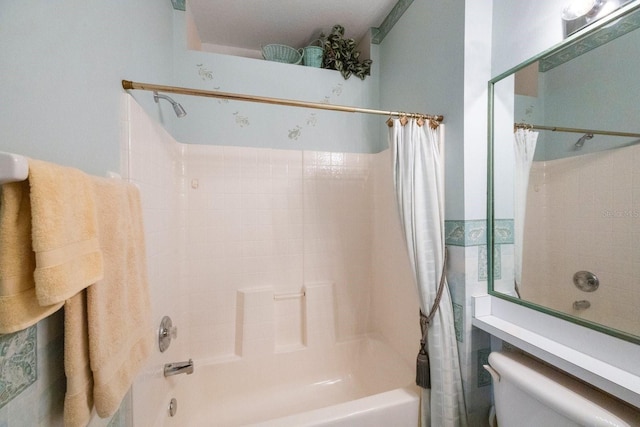 bathroom featuring shower / bath combination with curtain and toilet