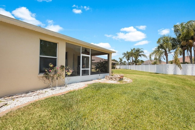 view of yard featuring a sunroom