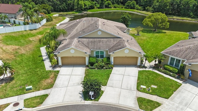 birds eye view of property with a water view