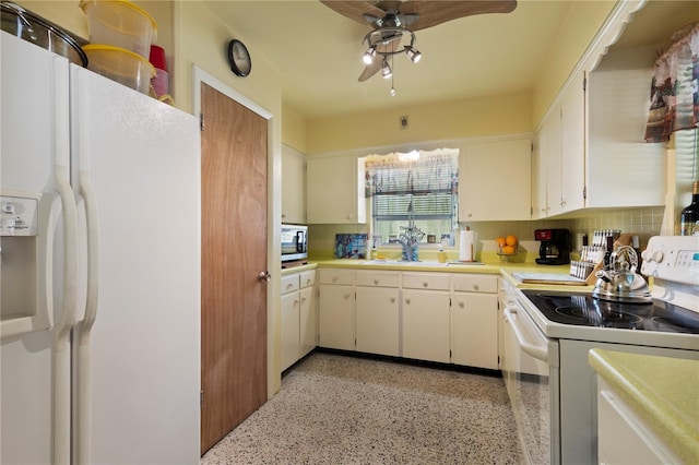 kitchen with white cabinetry, white appliances, and tasteful backsplash