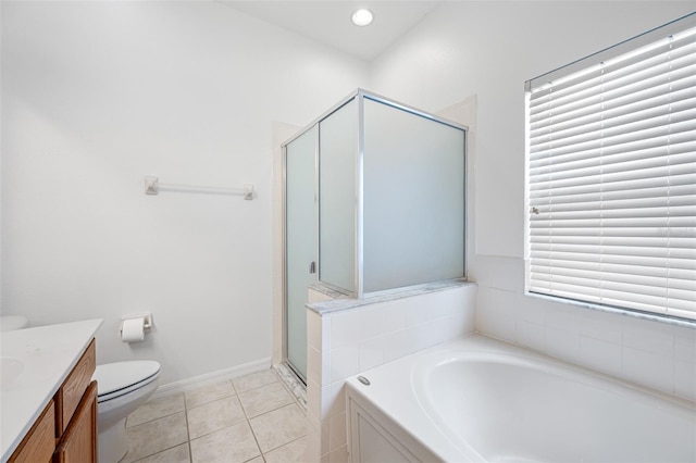 full bathroom featuring vanity, toilet, tile floors, and plus walk in shower