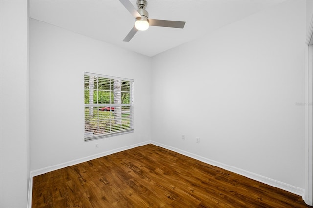 spare room featuring ceiling fan and dark hardwood / wood-style flooring