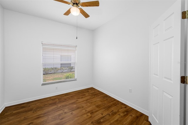 unfurnished room with dark hardwood / wood-style floors and ceiling fan