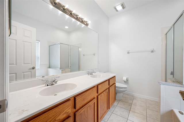 full bathroom featuring toilet, tile floors, large vanity, double sink, and plus walk in shower