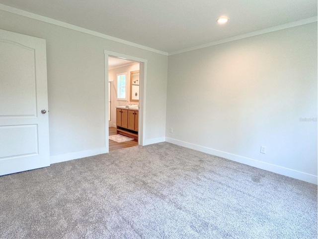 carpeted spare room with crown molding