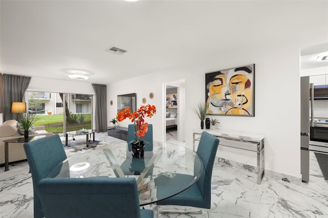 dining room featuring light tile floors