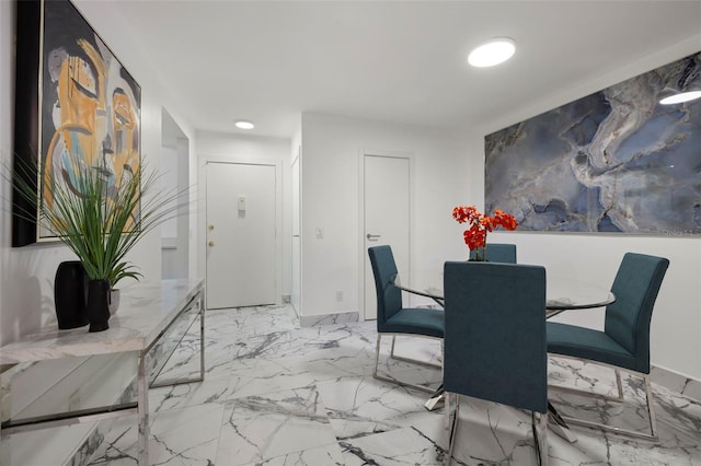 dining space featuring light tile flooring