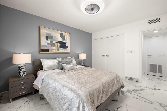 tiled bedroom featuring a closet