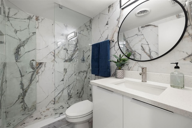 bathroom with tile walls, walk in shower, vanity, and toilet