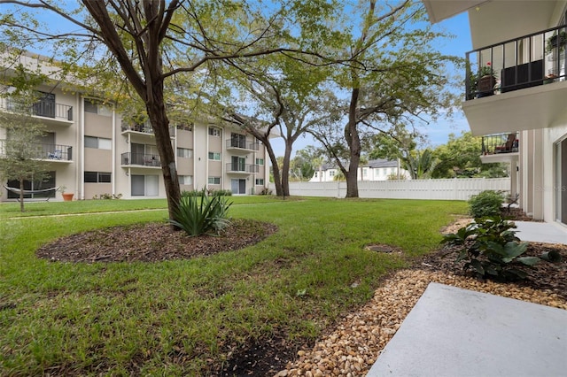 view of yard featuring a balcony