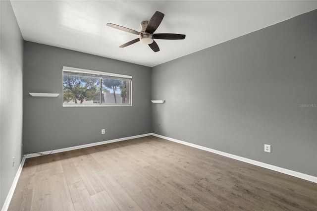 unfurnished room featuring hardwood / wood-style floors and ceiling fan