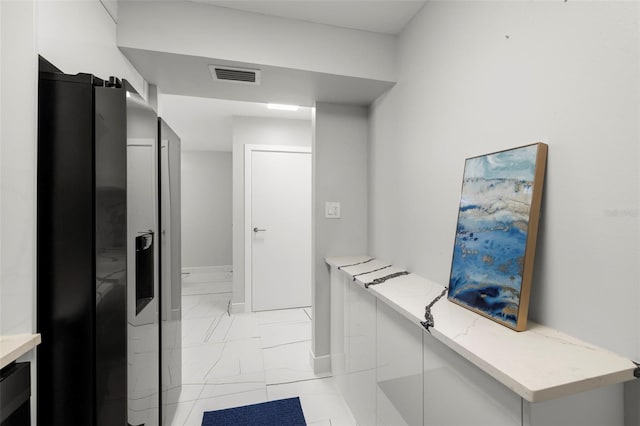 bathroom featuring tile flooring and vanity