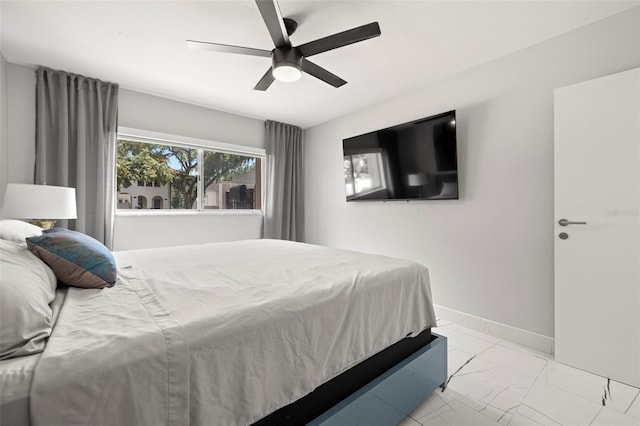 tiled bedroom featuring ceiling fan