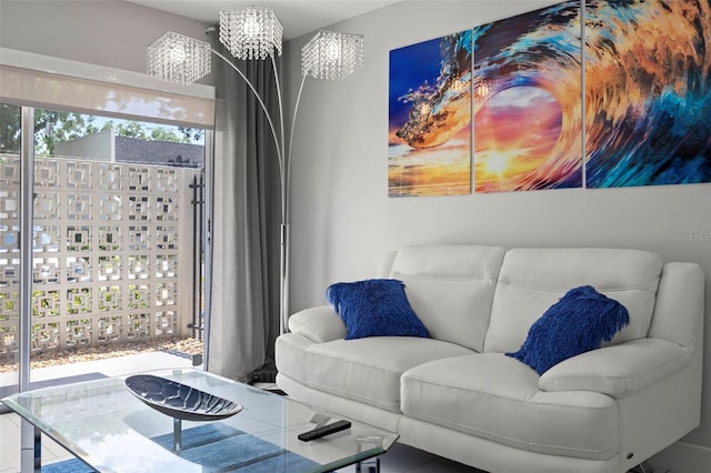 living room with an inviting chandelier