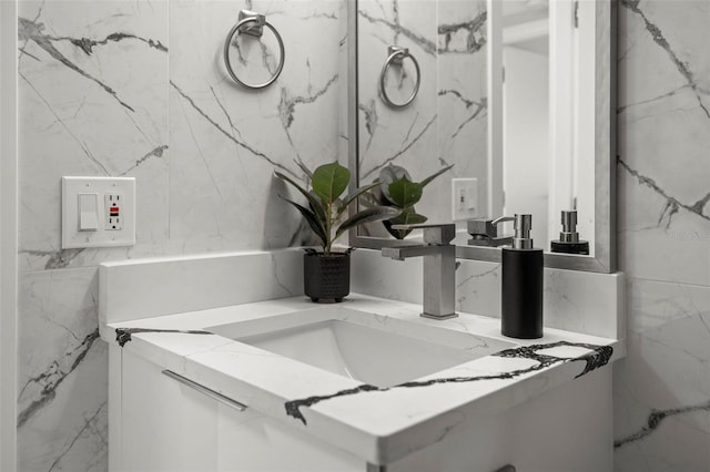 bathroom with tile walls and vanity