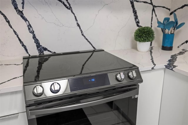 details featuring range with electric cooktop