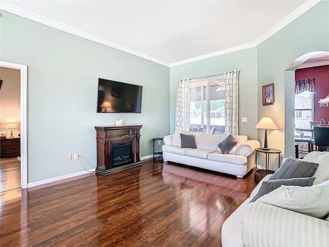 living room featuring dark wood-type flooring and ornamental molding