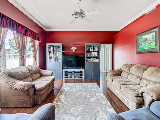 living room with hardwood / wood-style flooring, ceiling fan, and ornamental molding