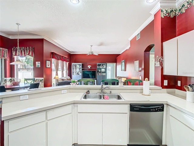 kitchen with dishwasher, white cabinets, crown molding, and sink