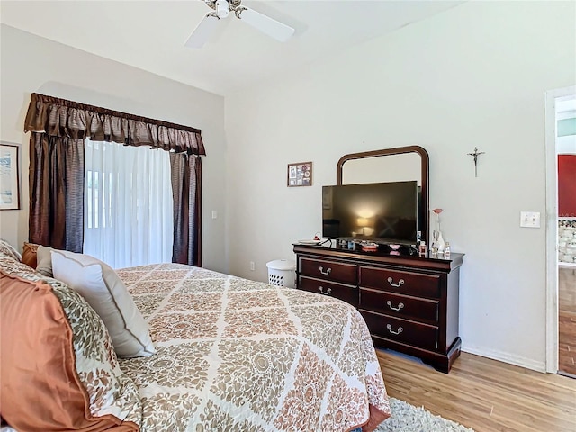 bedroom featuring ceiling fan and light wood-type flooring