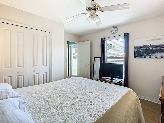 bedroom featuring hardwood / wood-style floors, ceiling fan, and a closet