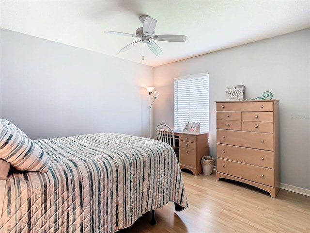 bedroom featuring light wood-type flooring and ceiling fan