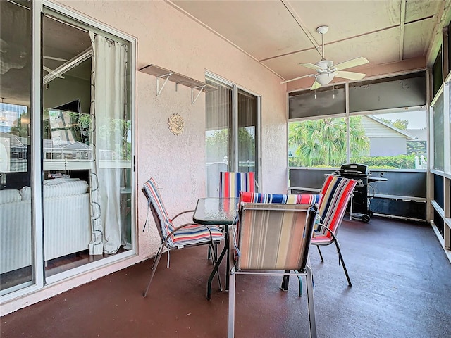 sunroom with ceiling fan and a healthy amount of sunlight