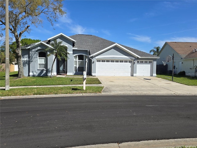 ranch-style house featuring stucco siding, an attached garage, concrete driveway, and a front lawn