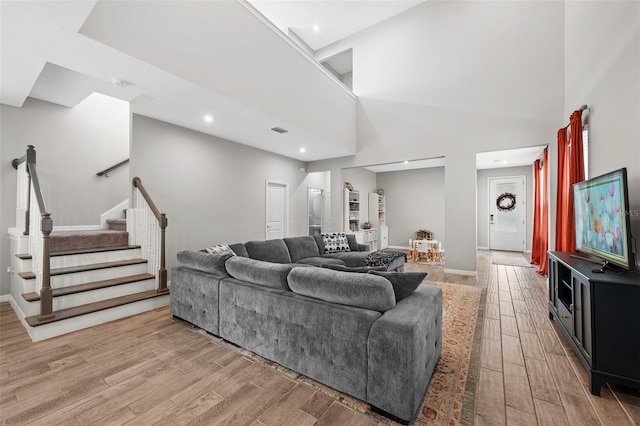 living room featuring a high ceiling