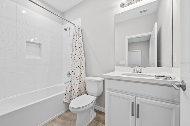 full bathroom featuring vanity, shower / bathtub combination with curtain, and toilet