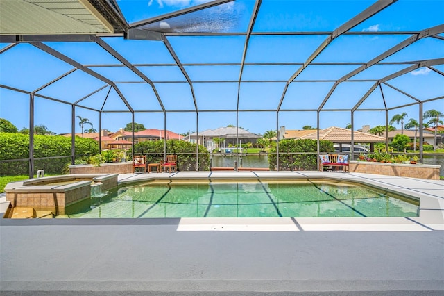 view of pool with an in ground hot tub, a water view, a patio area, and a lanai