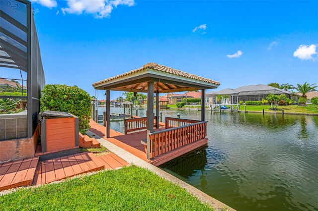 view of dock featuring a water view and glass enclosure