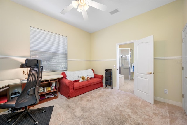 carpeted office space featuring ceiling fan