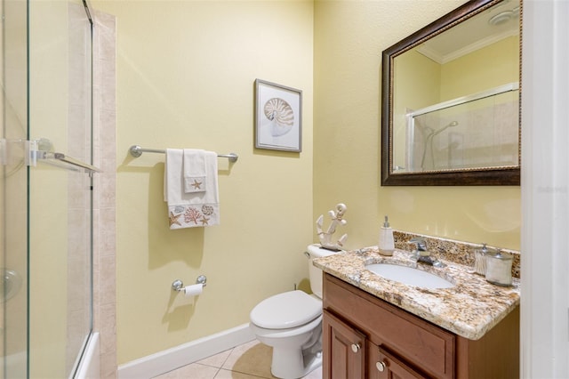 bathroom with tile patterned flooring, vanity, toilet, and crown molding