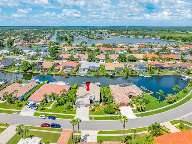 birds eye view of property featuring a water view