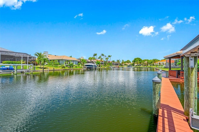 dock area featuring a water view and a residential view