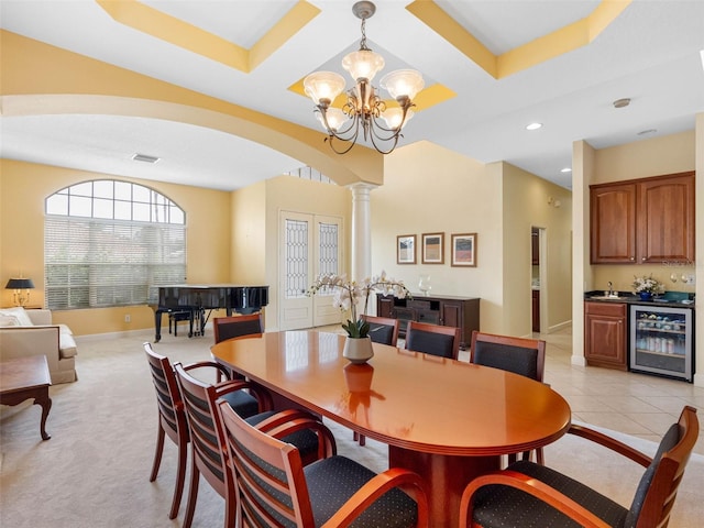 5510 E Longboat Blvd, Tampa, FL 33615 - dining room with indoor wet bar, wine cooler, ornate columns, visible vents, and recessed lighting