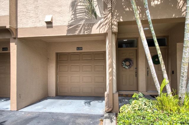 doorway to property featuring a garage