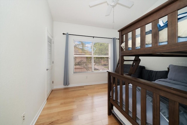 bedroom featuring a closet, ceiling fan, and light wood-type flooring