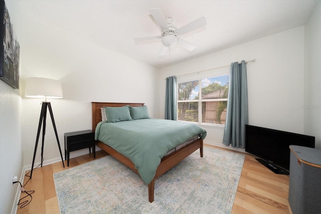 bedroom featuring ceiling fan and light hardwood / wood-style floors