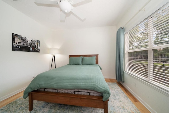 bedroom featuring ceiling fan and wood-type flooring