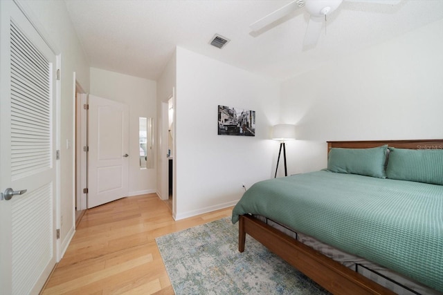 bedroom with wood-type flooring and ceiling fan