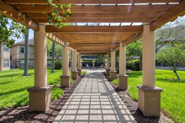 view of nearby features featuring a pergola and a lawn