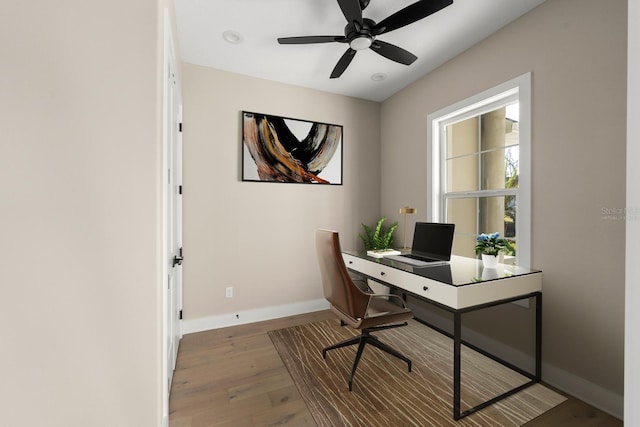 office space featuring hardwood / wood-style flooring and ceiling fan