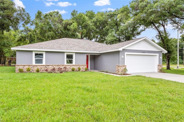 ranch-style house with a garage and a front lawn