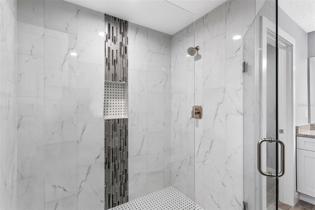 bathroom with a shower with shower door